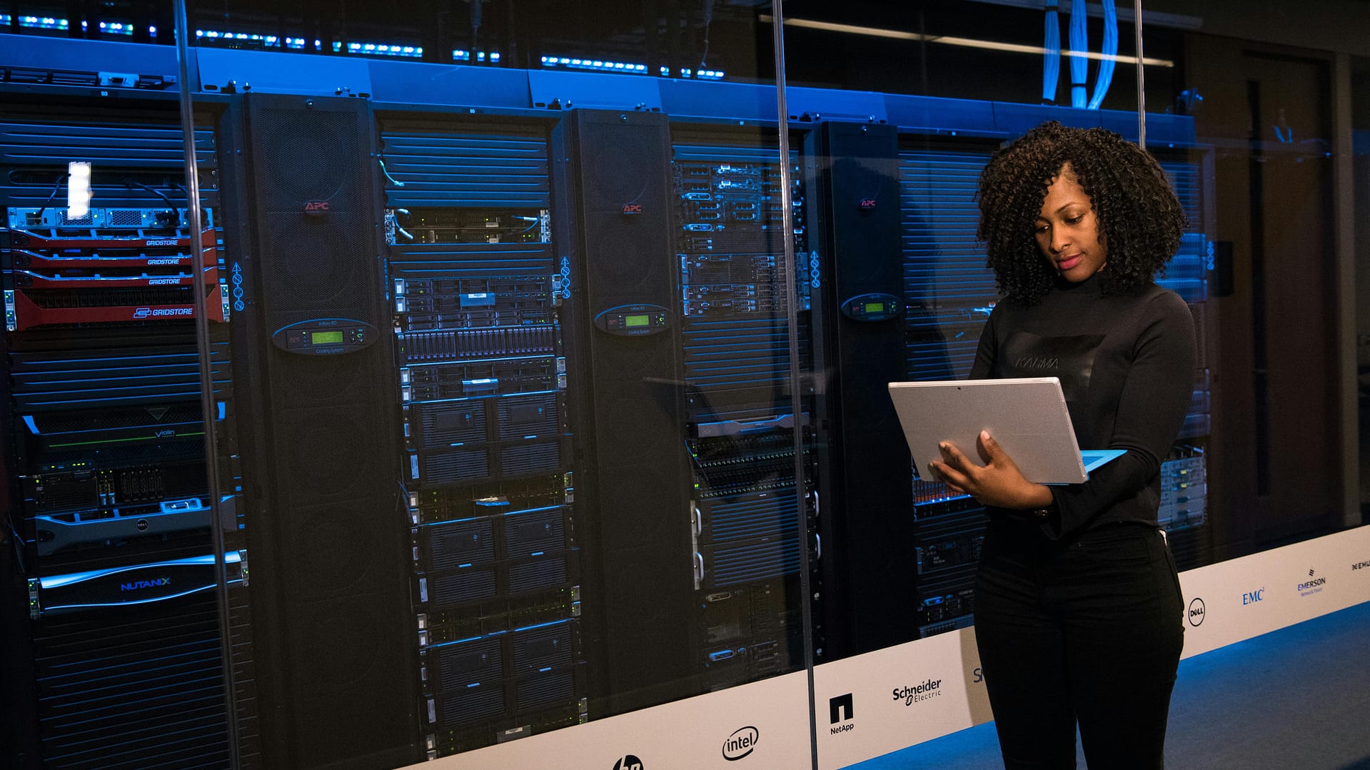 role of security teams in ai use -- a software engineer standing beside server racks