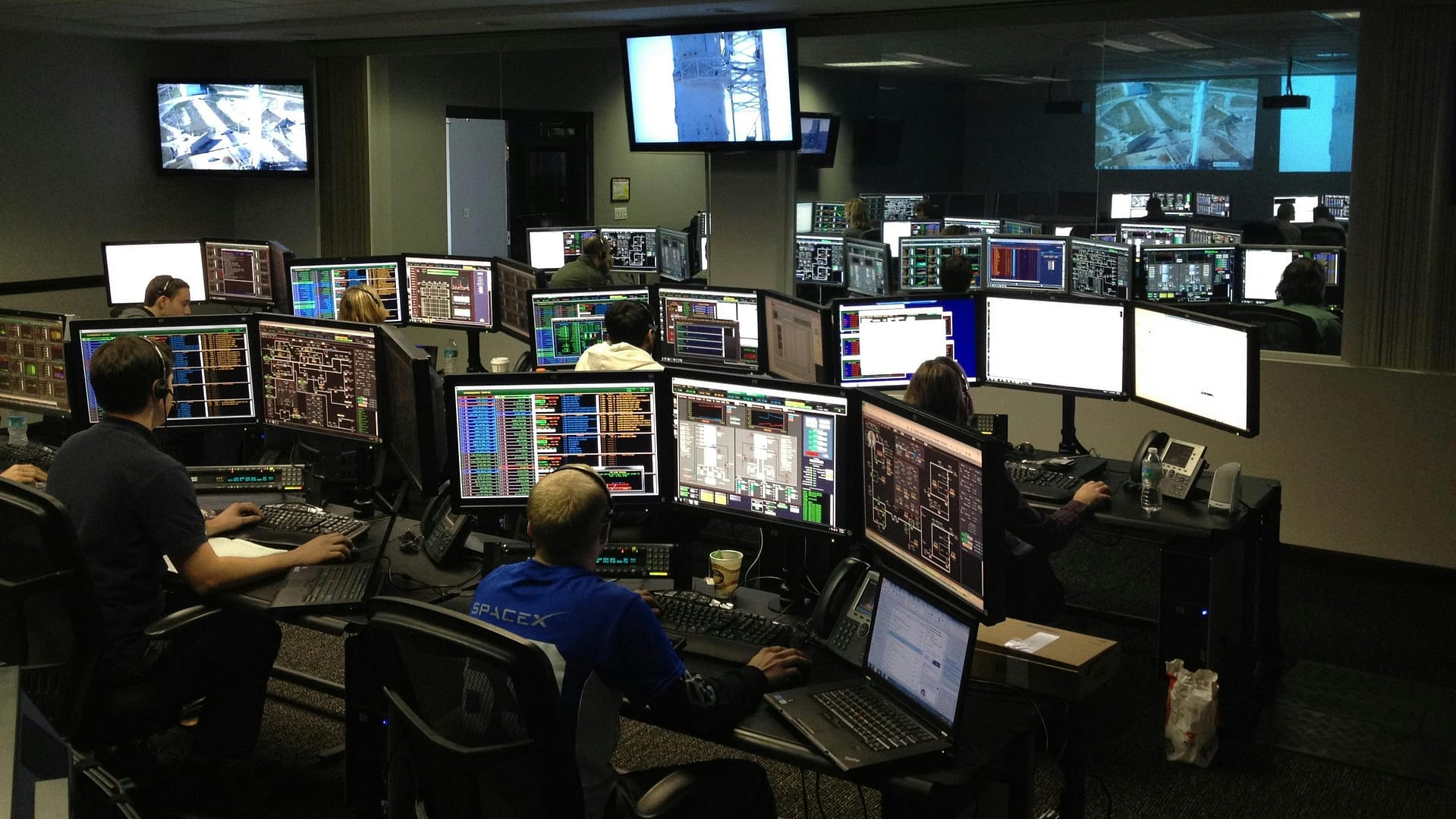 ai usage monitoring detect deter risky behavior -- a photo of a mission control center