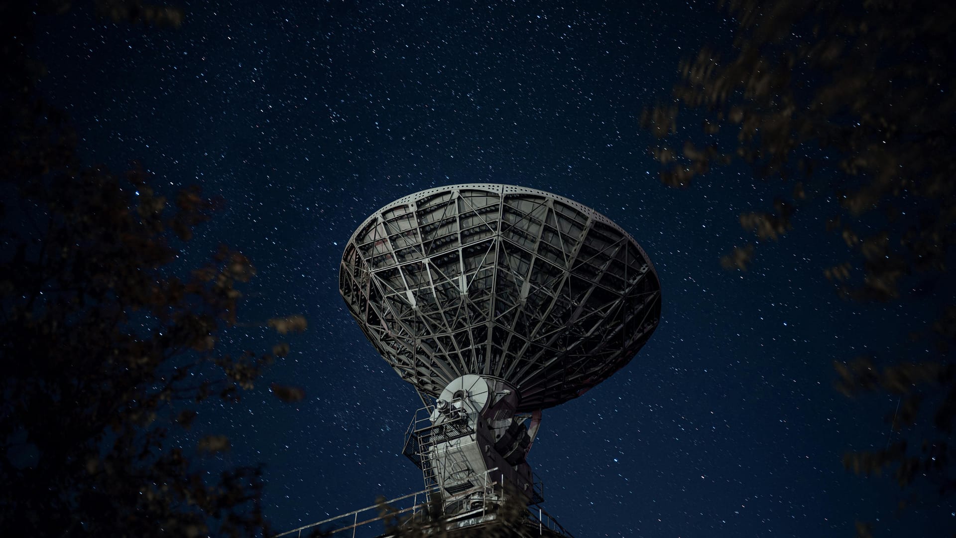 the case for prompt telemetry -- radio telescope against the sky with stars