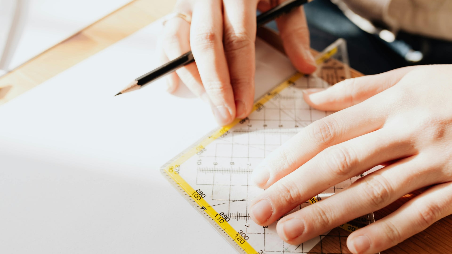 measuring ai risk -- a person using a ruler on white paper